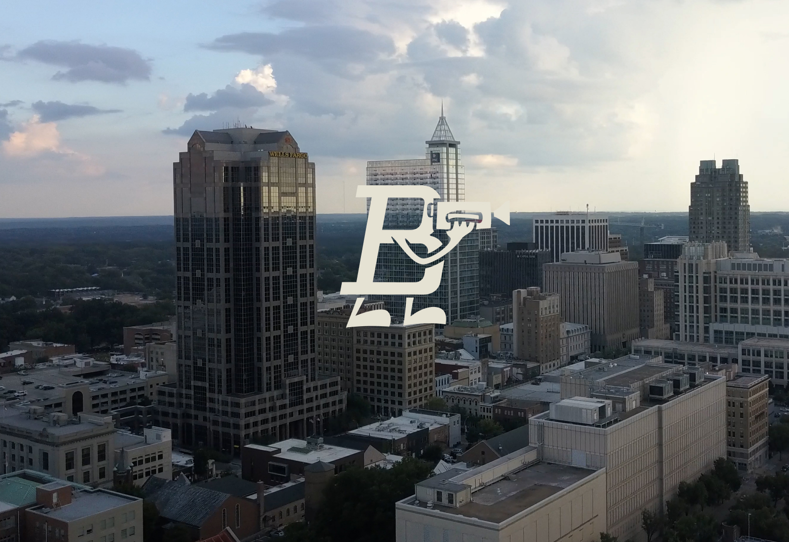 Bland Boy Mark over the Downtown Raleigh Skyline | Bland Creative | Brand Identity by Joey Carty at MRC