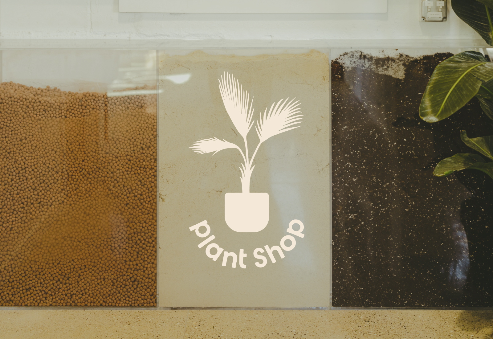 Secondary Logo over the Plant Shop's potting station | Brand Identity for Plant Shop GR - Grand Rapids, MI